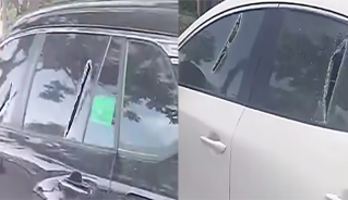 Hàng loạt ô tô bị chém vỡ kính. (Ảnh: Cắt từ clip)