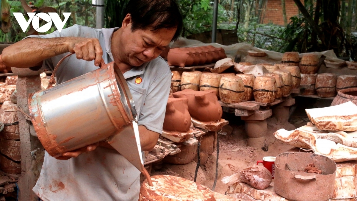 Nguyen Van Nhan, an artisan with 30 years of experience in the craft industry, says he has been given orders for a total of 10,000 buffalo-shaped ceramic products from various traders this year.