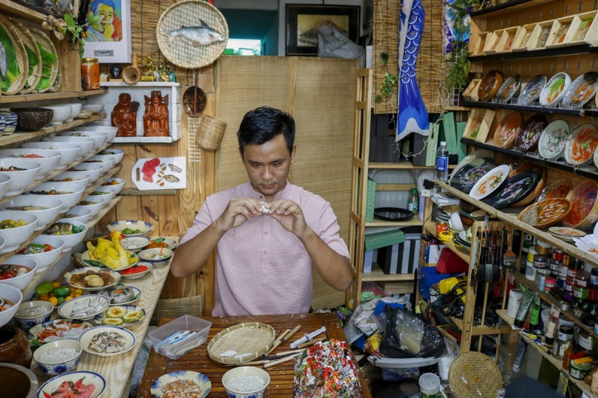 Nguyen Tan Dat from District 3 in Ho Chi Minh City says he has spent more than a month completing collections of Tet trays.