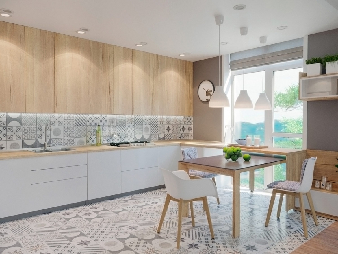 Hoạ tiết gạch bông tiếp tục "chạy" trong căn bếp vói thảm trải sàn, gạch ốp tường bếp. Bộ bàn ghế ăn màu trắng và gỗ tự nhiên hài hoà với hoạ tiết này, đặt bên cạnh cửa sổ lớn màu trắng đón ánh sáng mặt trời.