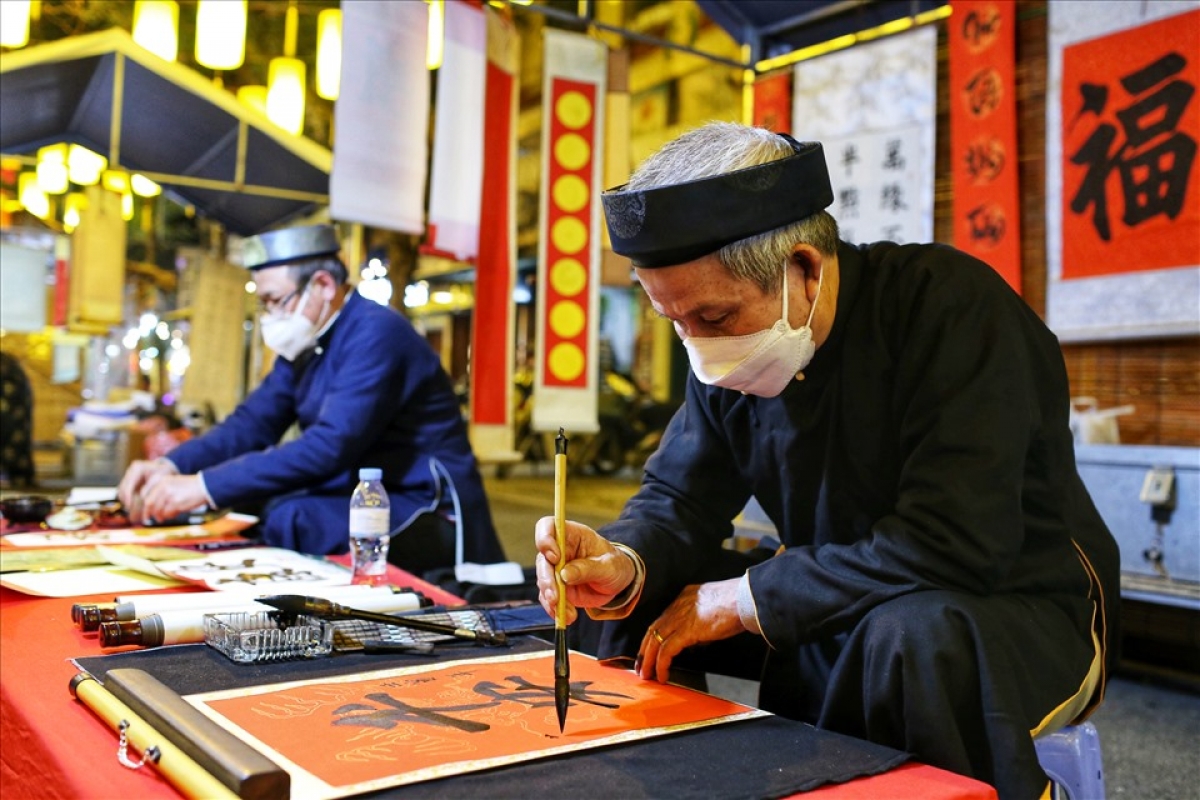 Artists display a wide range of calligraphic skills on Phung Hung street.