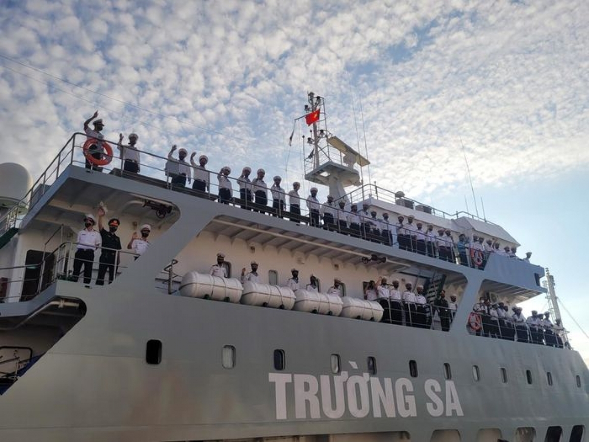 Sailors bid farewell whilst departing Cam Ranh port, Khanh Hoa province.