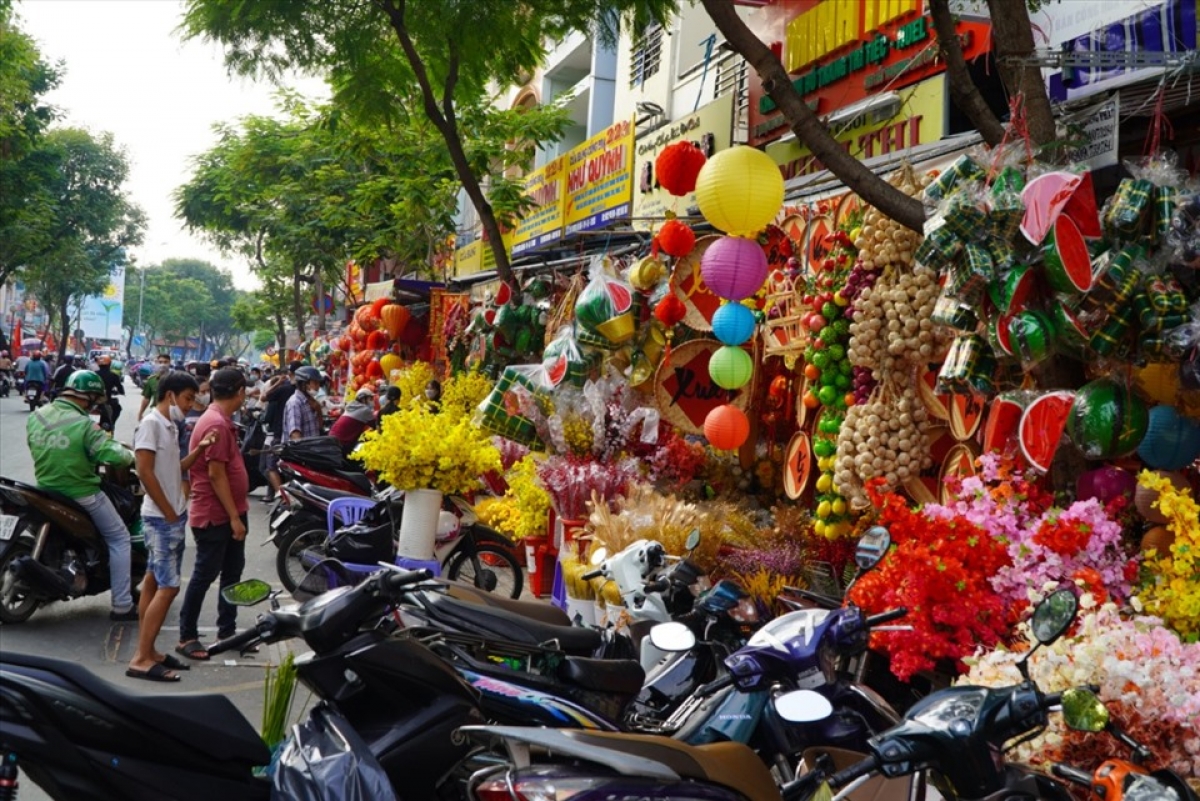 Lanterns, garlands, faux flowers, and envelops for lucky money can all be found throughout the street.