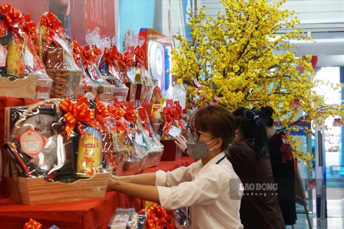 Staff continuously add goods to the shelfs at Mega Market.