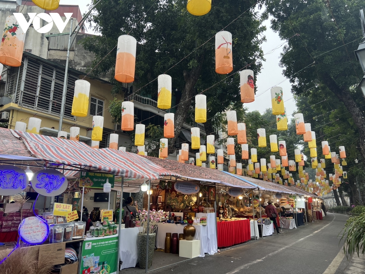 Phung Hung mural street hosts a goods fair, art programmes featuring traditional music, and dance activities as a way of welcoming in the Lunar New Year festival.