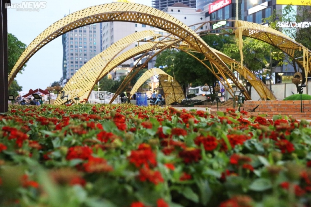 A large number of potted flowers are transported to the venue as part of the decoration.