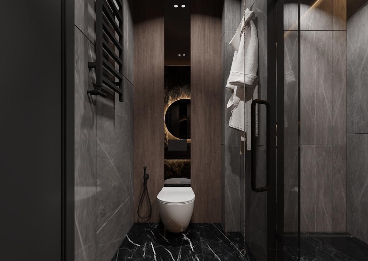 Sàn gạch đen được thiết kế như bao phủ nội thất phía bên trong phòng tắm. Các tấm gỗ giúp tạo sự ấm áp và làm tăng độ tương phản của sắc đen xung quanh, kết hợp cùng vách kính ngăn khu vực tắm đứng.
