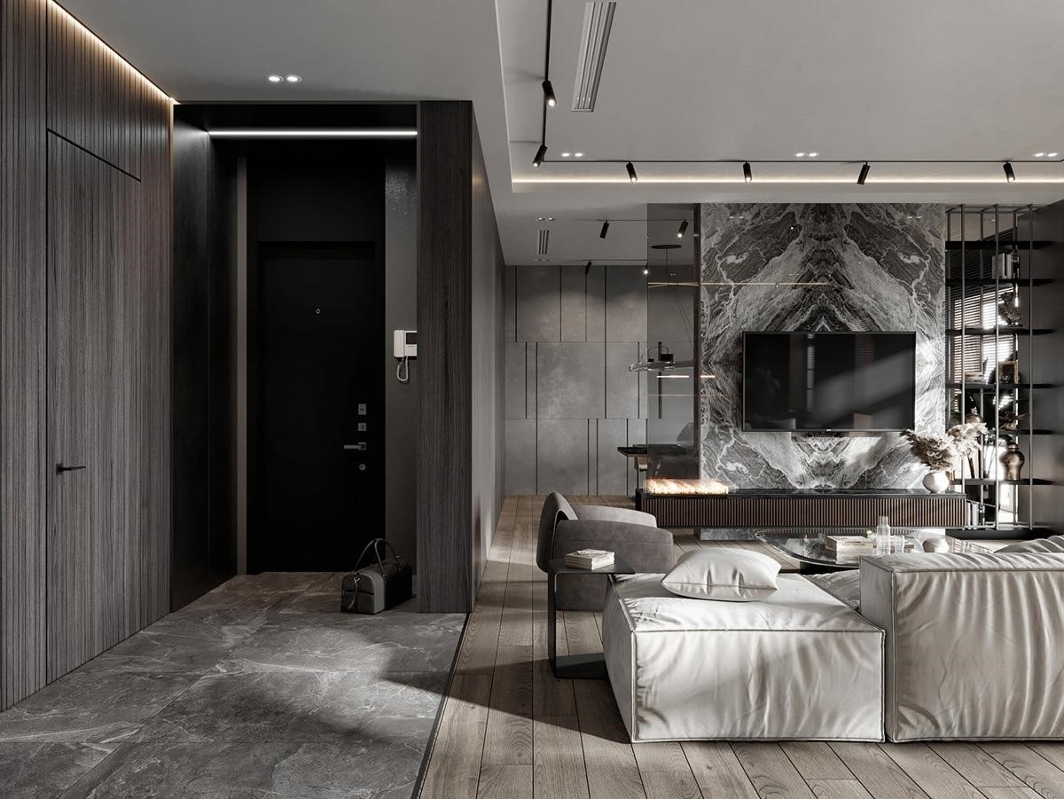 Phòng khách mở ra lối đi vào nhà và hành lang. Gạch lát sàn được phân chia rõ ràng khu vực di chuyển lối ra vào nhà với không gian phòng khách.