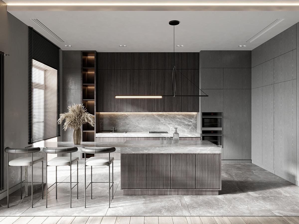 Ba chiếc ghế quầy bar hiện đại xếp dọc theo bàn bếp được ốp đá cẩm thạch, ghế được hướng về phía nhà bếp. Các tủ bếp có kết cấu rãnh thời trang, tạo ra sự tương phản sâu sắc với mặt bàn ốp đá cẩm thạch.