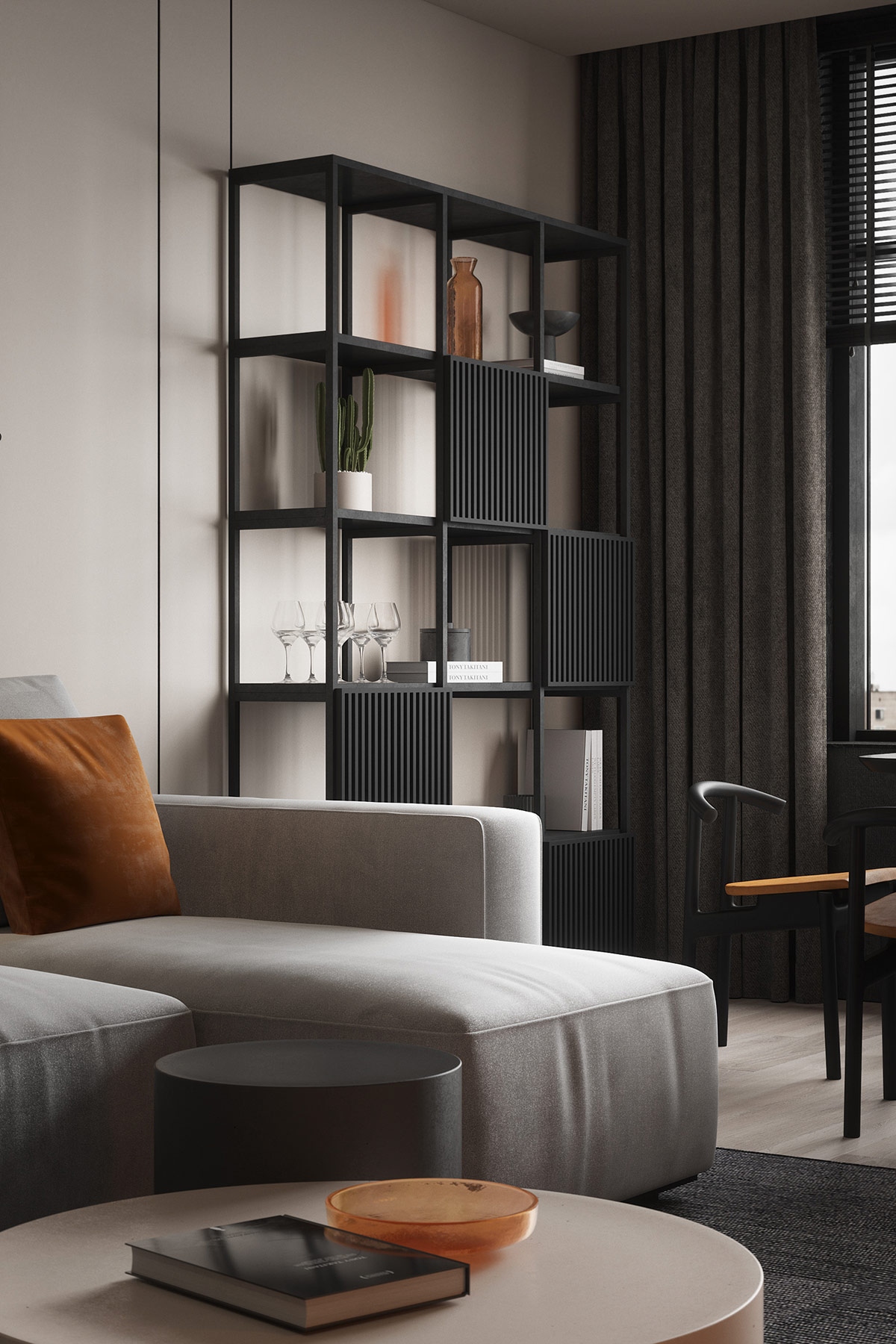 Một chiếc bát trang trí đặt điểm nhấn màu nâu lên bàn cà phê màu xám ở giữa phòng.