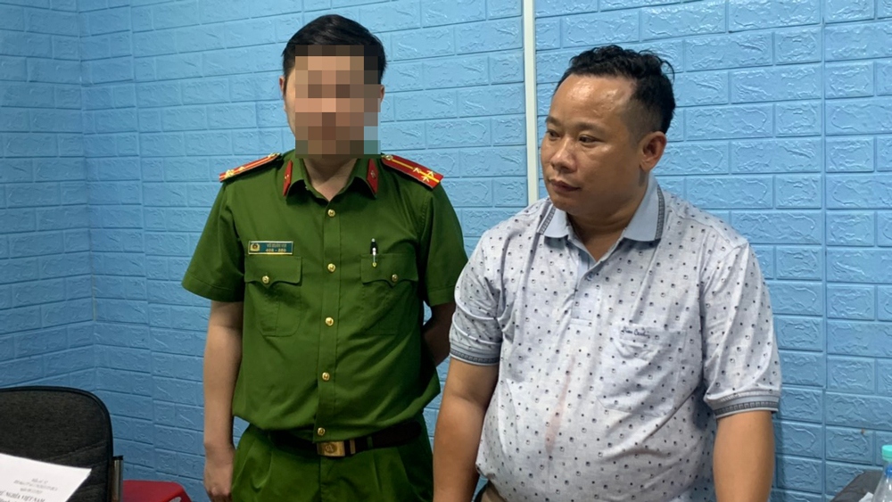 Ông Nguyễn Văn Minh bị bắt giữ (ảnh: CA)