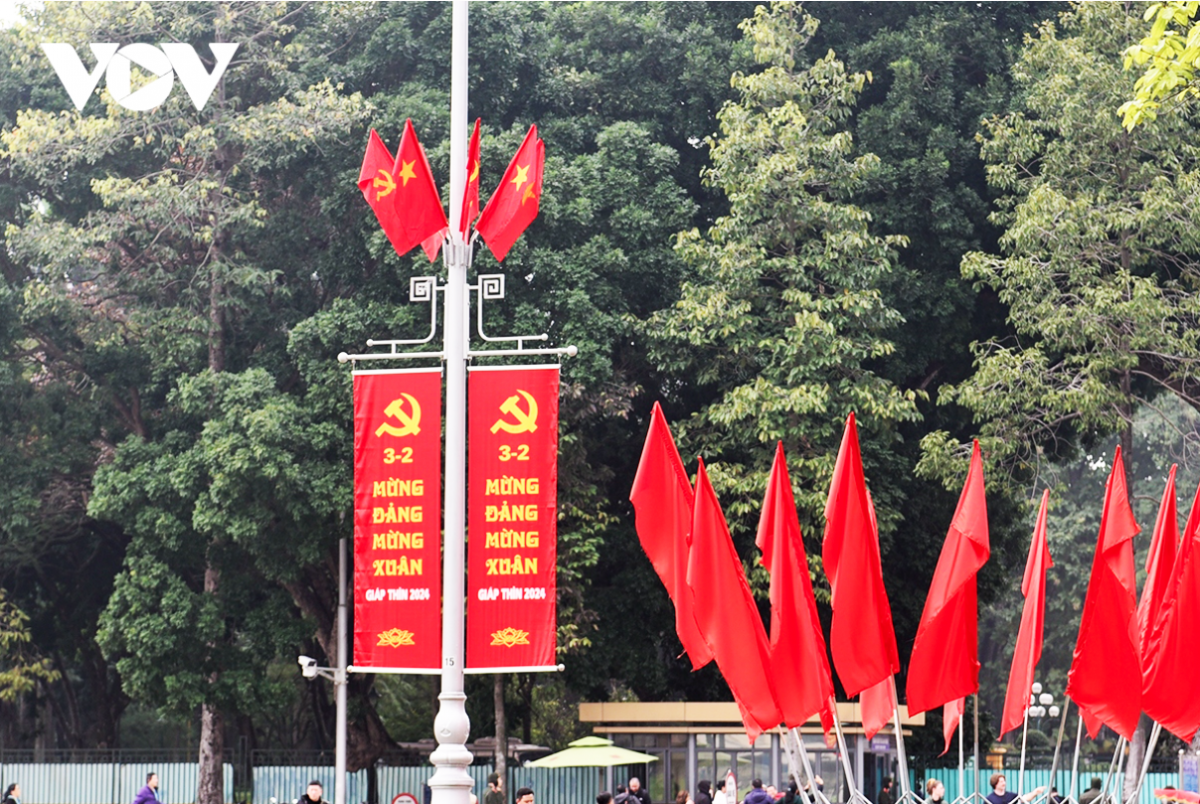 Posters are hung everywhere, with some reading “Happy New Year 2024 – the Year of the Dragon”, “Happy New Spring” or “Celebrating 94 Years of the Communist Party of Vietnam”.