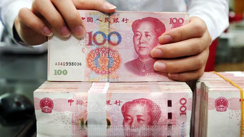 Đồng 100 NDT của Trung Quốc - Ảnh minh họa: AFP/TTXVN