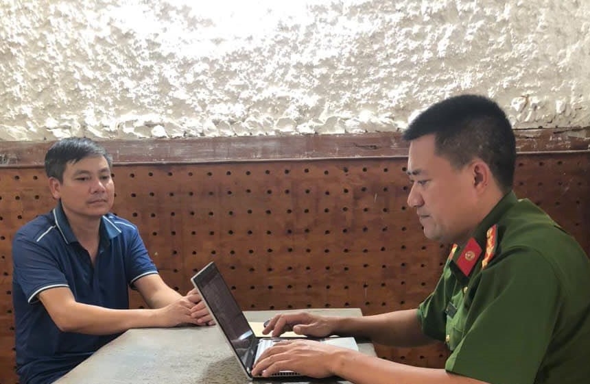 Đối tượng Trần Văn Huy làm việc với cơ quan công an.