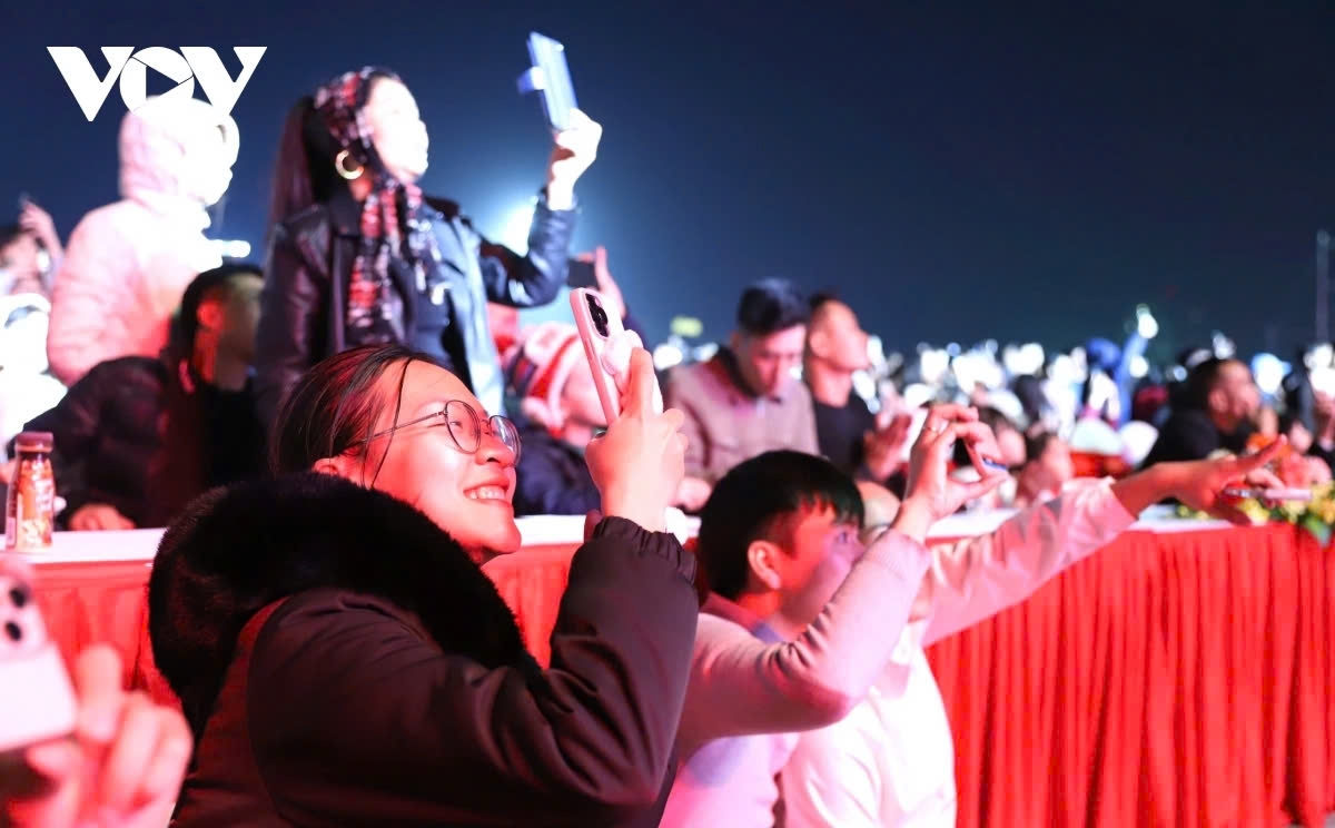 The locals take the opportunity to capture wonderful moments on their phones as they step into the New Year 2025.