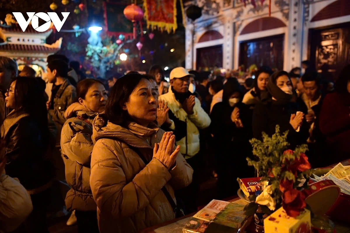 The sea of worshippers fill the area, all eager to participate in the first prayers and offerings of the new year, creating a vibrant and lively atmosphere of faith and celebration.