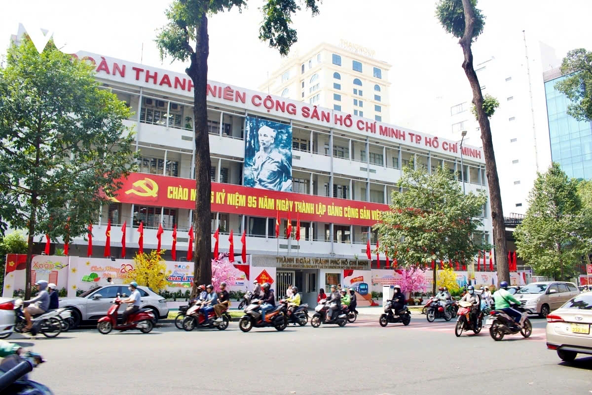 The headquarters of the Ho Chi Minh City Youth Union is adorned with vibrant flags and flowers.