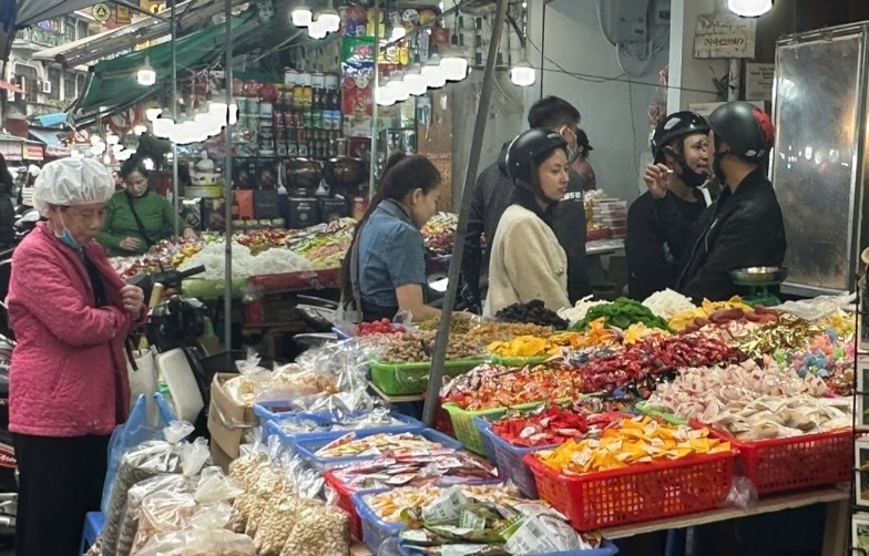 Dried fruits, imported candies, and Tet jam are popular items for sale on Hang Buom Street.