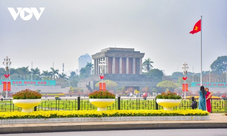 Streets like Hung Vuong, Hoang Dieu, and Dien Bien Phu in Hanoi are dressed in red.