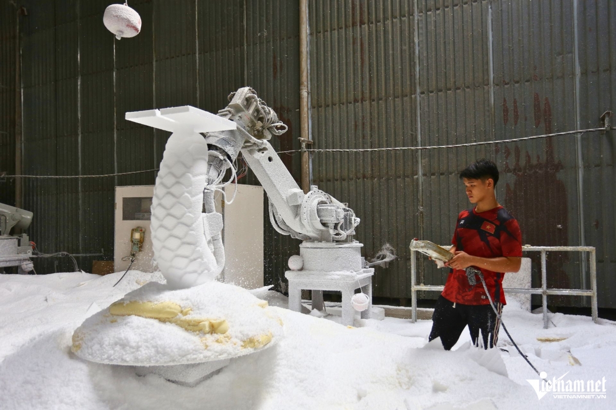 One stage in the process of making the snake mascots uses a machine.