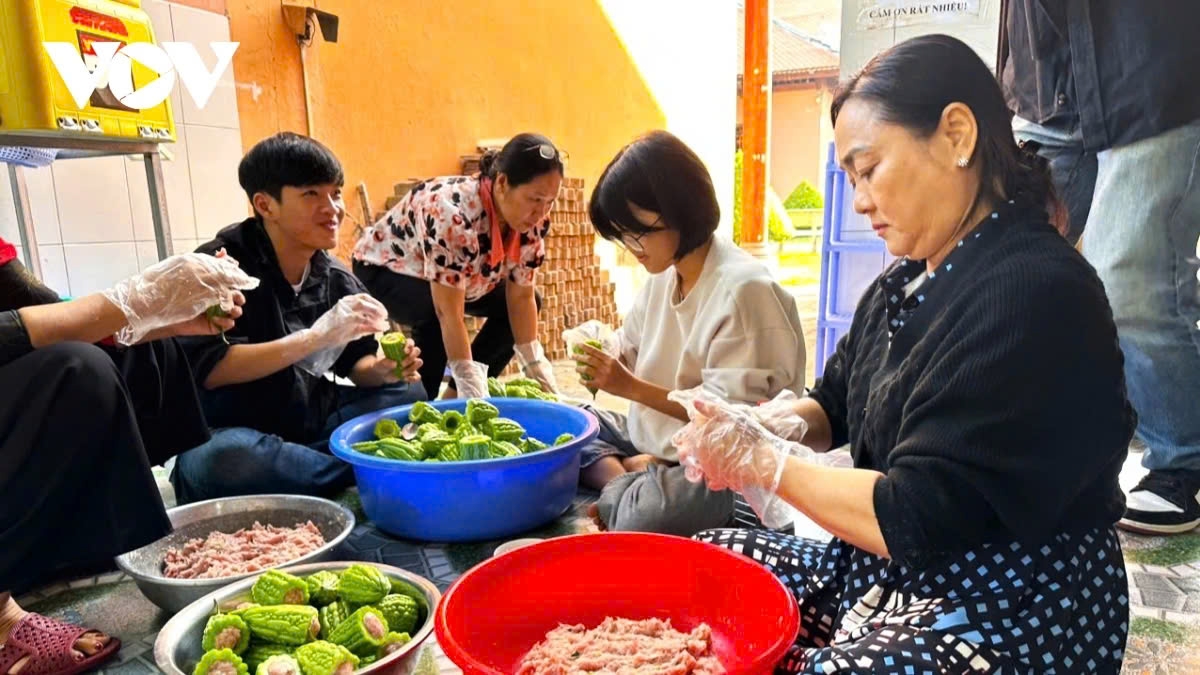 Volunteers prepare dishes for the year-end party for patients in need