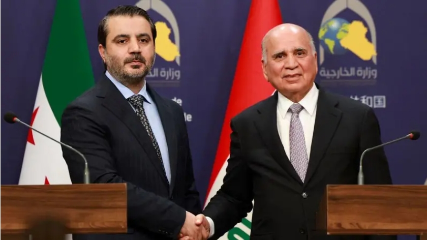 Ngoại trưởng Syria Asaad Hassan al-Shibani (trái) và Ngoại trưởng Iraq Fuad Hussein. (Ảnh: AFP)