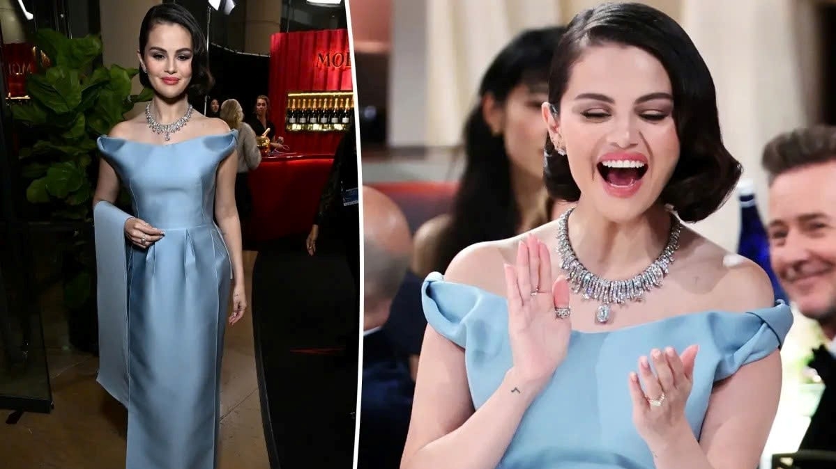 Selena Gomez đã biến thảm đỏ Quả cầu vàng 2025 thành một câu chuyện cổ tích khi xuất hiện lộng lẫy trong chiếc váy xanh trễ vai lấy cảm hứng từ Lọ Lem của Prada. Tại sự kiện do diễn viên hài Nikki Glaser dẫn chương trình, Selena khoe vẻ đẹp kiêu sa trong bộ váy xanh nhạt, được tô điểm bởi những món trang sức kim cương đắt giá. Chiếc vòng cổ Tiffany &amp; Co. lấp lánh với hơn 18 carat kim cương cùng đôi hoa tai đồng bộ càng làm tăng thêm vẻ sang trọng, được phô bày trọn vẹn nhờ mái tóc úp ra sau đầy kiêu hãnh.