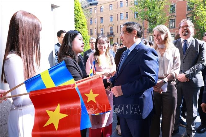 Thủ tướng Phạm Minh Chính gặp gỡ sinh viên, lưu học sinh Việt Nam. (Ảnh: Dương Giang/TTXVN)