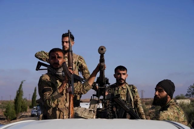 Các thành viên lực lượng an ninh Syria tại thành phố Sweida. ẢNH: REUTERS