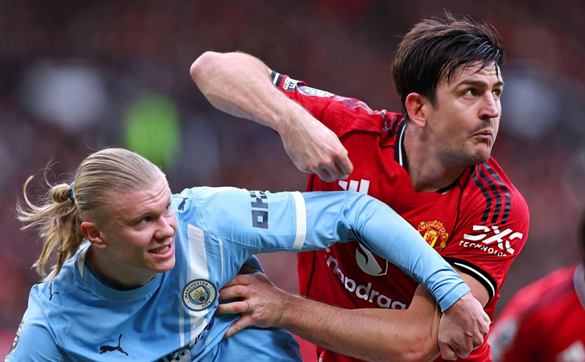 Maguire và Lisandro "bỏ túi" Haaland ở trận derby Manchester. (Ảnh: Getty)
