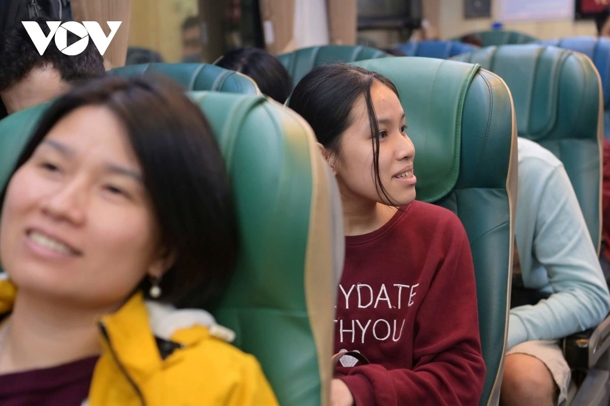 Passengers quietly settle into their seats, each carrying a story of their own aboard the overnight journey.