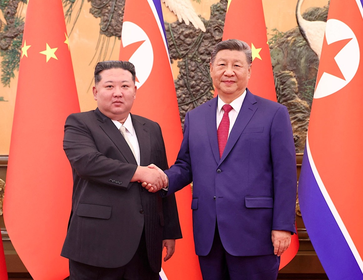 Nhà lãnh đạo Triều Tiên Kim Jong Un và Chủ tịch Trung Quốc Tập Cận Bình. Ảnh: Reuters