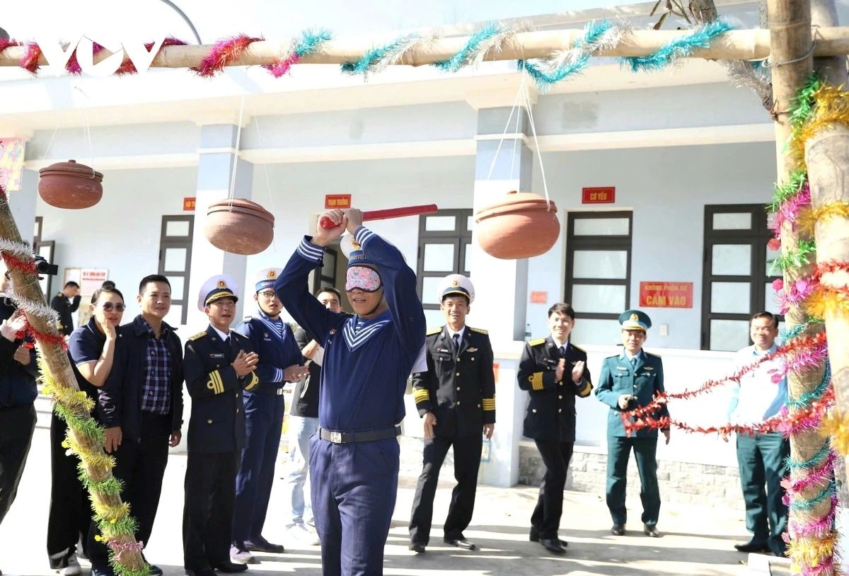 Officers and soldiers take part in a numberd of Spring folkgames, creating a jubilant Tet atmosphere