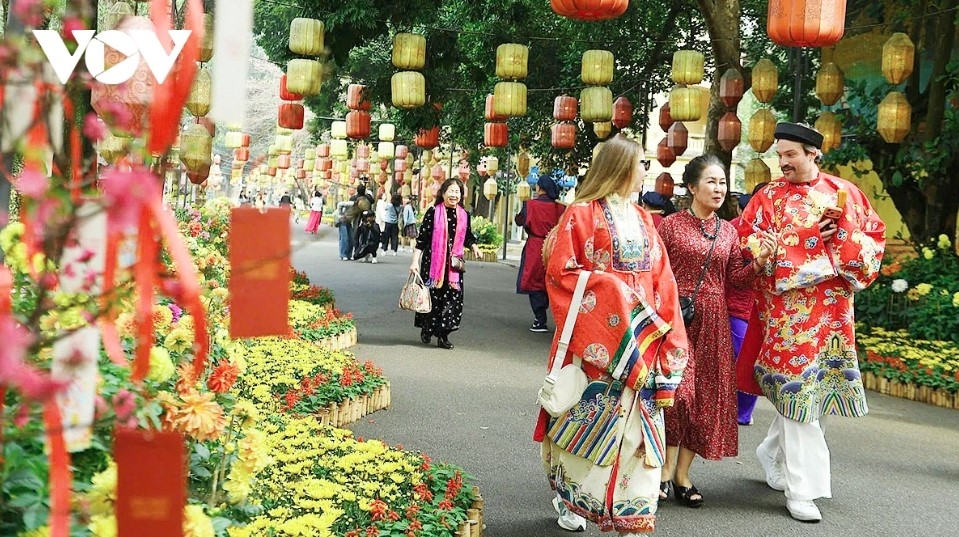 Inside the Thang Long Imperial Citadel, walkways are decorated with flowers, lanterns, and Thang Long–Hanoi cultural symbols.