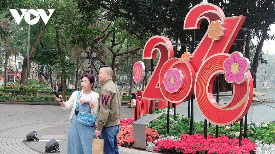 New Year 2026 symbols around Hoan Kiem Lake draw residents and visitors for photos.