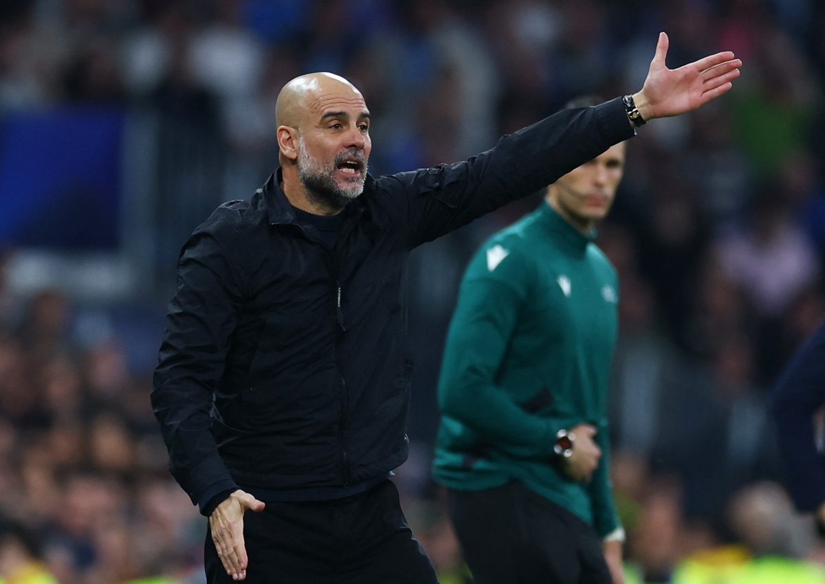 Đội bóng của HLV Pep Guardiola đang gặp khó trước Real Madrid (Ảnh: Reuters).