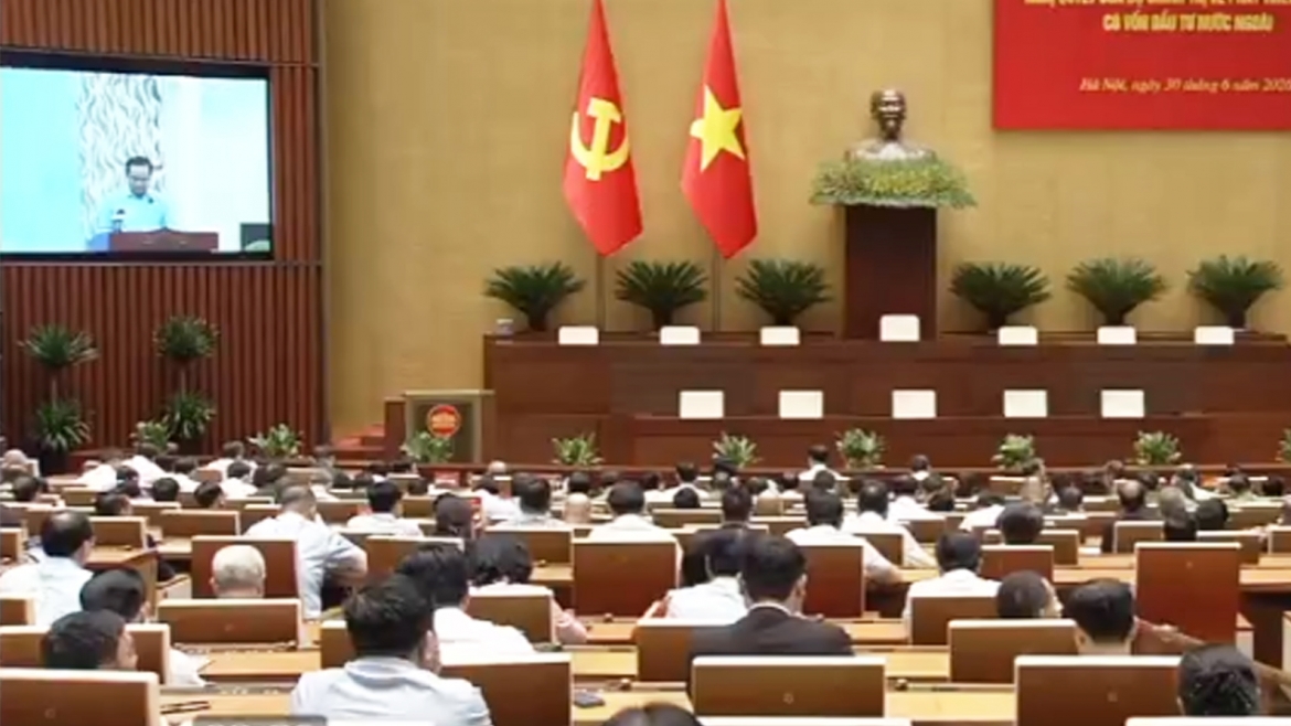 Ông Nguyễn Văn Được, Chủ tịch UBND TP. Hồ Chí Minh báo cáo trực tuyến từ TP.HCM tới điểm cầu hội trường Ba Đình. (Ảnh chụp màn hình)